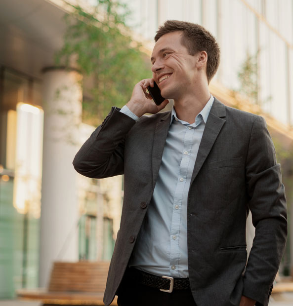 A man in a suit is engaged in a conversation