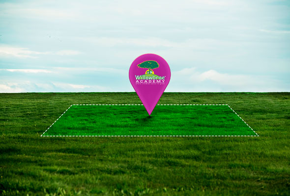 A pink marker stands out on a green field